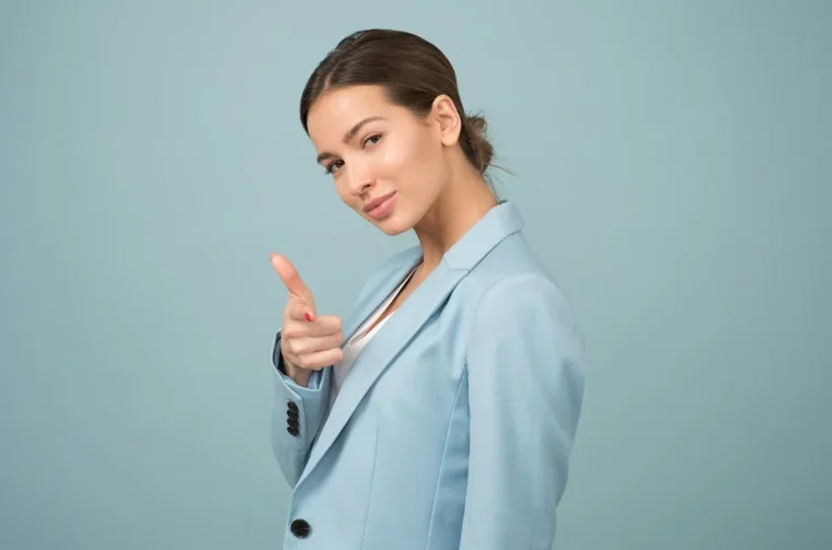 Smiling Woman Wearing a Blue Suit Jacket
