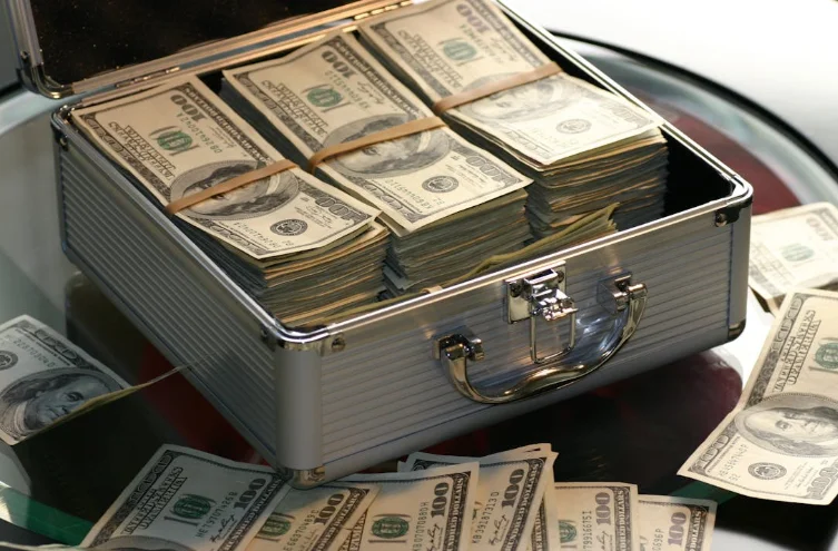Metal Case Full of Money and Sitting on a Table
