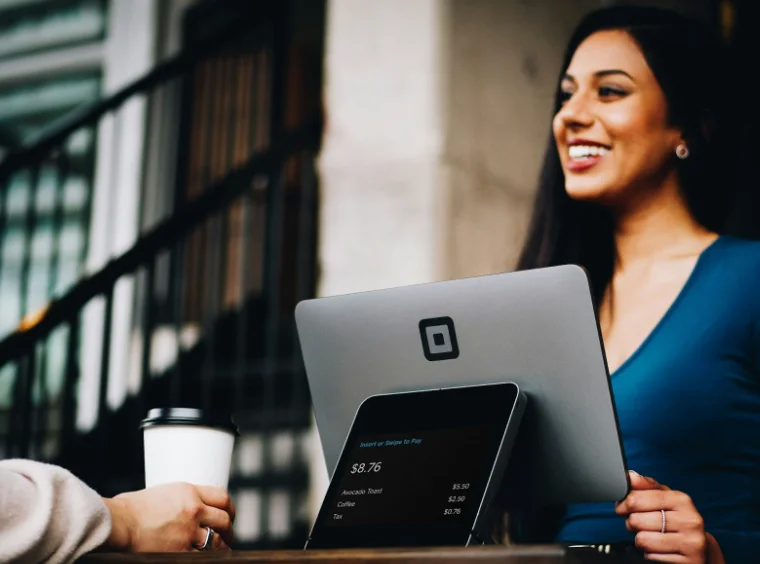 Smiling Woman Providing Customer Service