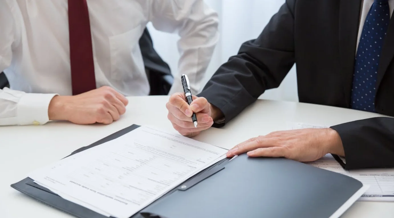 Business Person Signing Paperwork