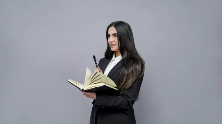 Female with Long Dark Hair Holding a Book